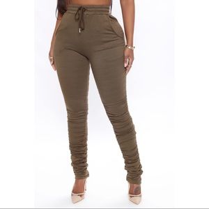 Olive green skinny tapered leg stacked sweatpants